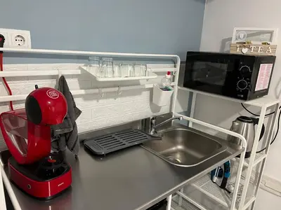 a kitchen counter with a mixer and a sink at Vi Del Mar Apartments Varna in Varna City