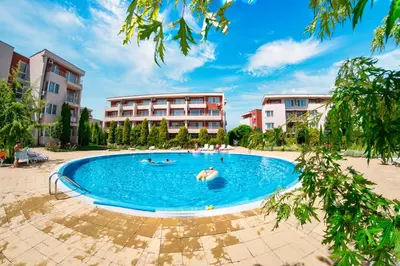 a group of people swimming in a swimming pool at Nessebar and Holiday Fort Apartments in Sunny Beach