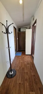 a room with a wooden floor and a pole on the floor at Bungalow GHP-B in Varna City