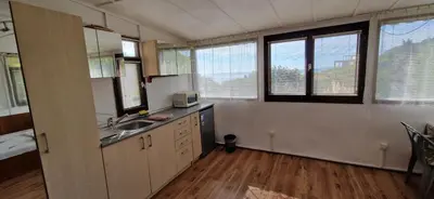 a kitchen with a sink and a counter top at Bungalow GHP-B in Varna City