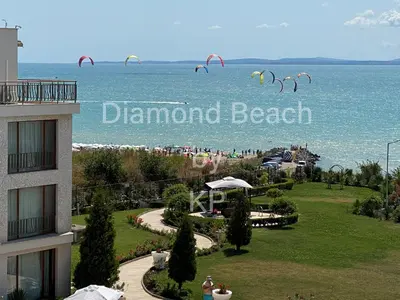 a group of kites flying in the air over the ocean at Diamond Beach Sarafovo by KP - Luxury Collection, Apt 6 in Burgas City
