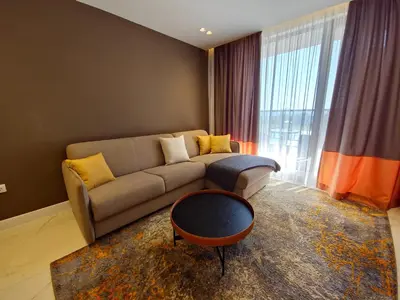a living room with a couch and a table at Diamond Beach Sarafovo by KP - Luxury Collection, Apt 6 in Burgas City