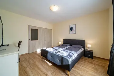 a bedroom with a large bed in a room at Sunny and Quiet 2bdr Central Apartment in Varna City
