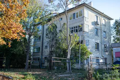 a large stone building with trees in front of it at Sunny and Quiet 2bdr Central Apartment in Varna City