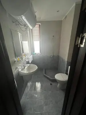 a bathroom with a sink and a toilet at Велика Гардън - Акация 6 in Lozenets