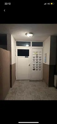 a large white garage door in a room at Sity Home in Burgas City