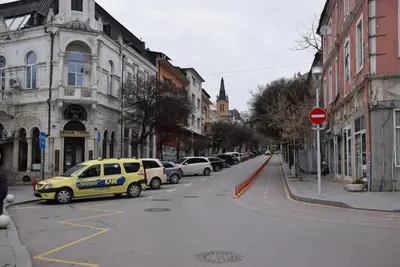 a yellow police car parked on the side of a street at Оазис 1 във Варна in Varna City