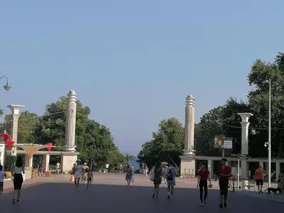 a group of people walking in front of a building at Оазис 2 във Варна in Varna City