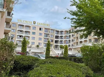 a large white building with a sign on it at Sonne, Meer und mehr in Nesebar