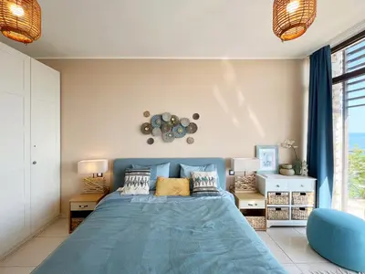 a bedroom with a blue bed and a large window at Dolce Vita Blue Boho, Premium Apartment with seaview in Sveti Vlas