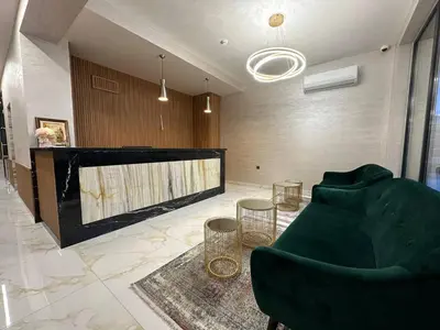 a living room with a couch and a large fireplace at Emilia Romana Park in Sunny Beach