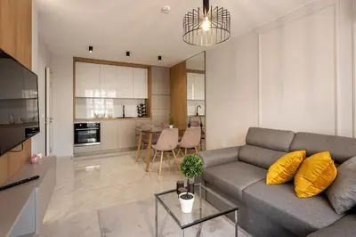a living room with a couch and a table at Emilia Romana Park in Sunny Beach