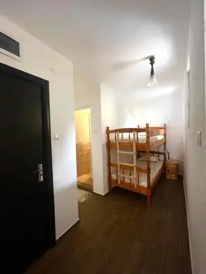 a hallway with a room with a bed and a door at Sozopol Old Town - Studio 1 in Sozopol