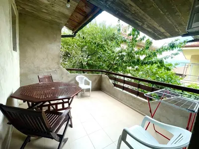 a balcony with two chairs and a table and chairs at Sozopol Old Town - Studio 1 in Sozopol