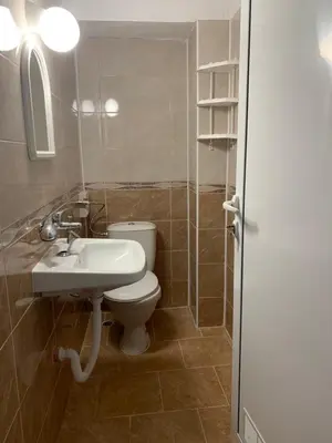 a bathroom with a white toilet and a sink at Sozopol Old Town - Studio 1 in Sozopol