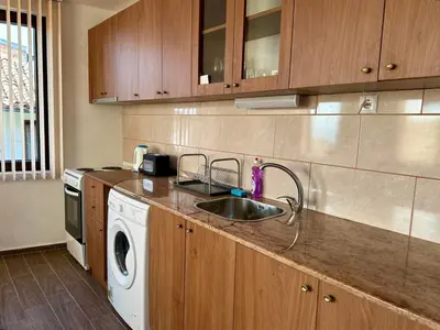 a kitchen with a sink and a washing machine at Sozopol Old Town - Apartment 3 in Sozopol