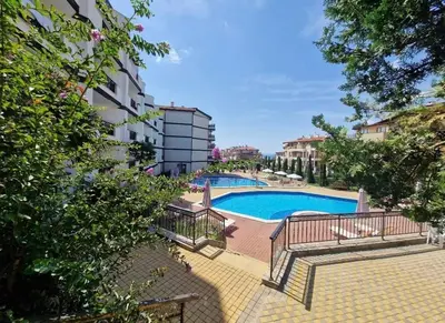 a view of a swimming pool in a building at Студио Sun day в Royal palm, Свети Влас in Sveti Vlas