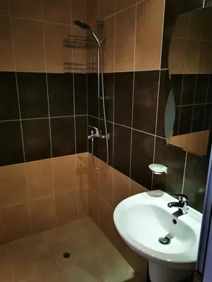a bathroom with a sink and a shower at Студио Sun day в Royal palm, Свети Влас in Sveti Vlas