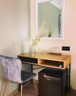 a desk with a chair and a mirror at Drive Point (Adventure Lake Resort) in Asparukhovo