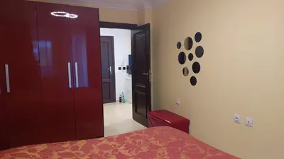a bedroom with a bed and a door to a hallway at Monastery II Garden stay like home in Sveti Vlas