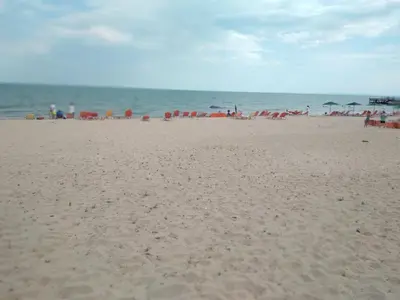 a beach with umbrellas and people on the beach at Курортен коплекс Елените,община Несебър,област Бургас in Emona