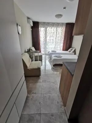 a small room with two beds and a couch at Admiral Plaza Sunrise Apartments C13 in Sunny Beach