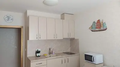 a kitchen with a sink and a microwave at Aphrodite Park in Sunny Beach