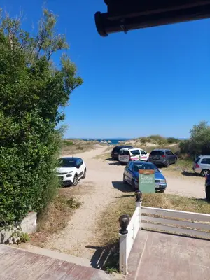 a bunch of cars parked in a parking lot at Апартамент Царски бриз in Sozopol