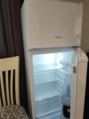 an empty refrigerator with its door open in a room at Afrodita Palas , studio appartment 4 floor, pool view in Sunny Beach