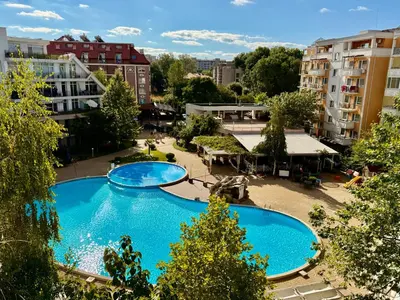 an overhead view of a large swimming pool in a city at Charming 2-bed flat with pool view in Sunny Beach, Bulgaria in Sunny Beach
