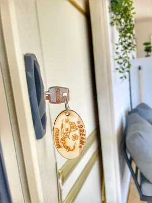 a door lock with a picture of a dog on it at каравани Дрийм Арапя in Tsarevo