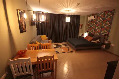 a living room with a table and a couch at Apartment Daisy Grand Kamelia in Sunny Beach