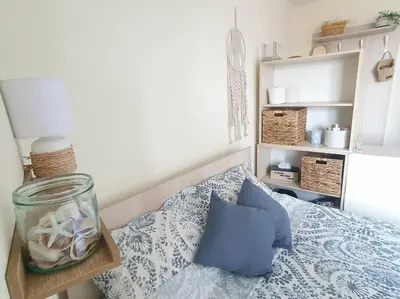 a bedroom with a bed with a jar on it at Sunset Dreams apartment in Burgas City