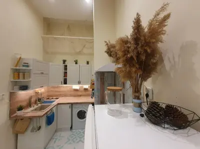a kitchen with a sink and a washing machine at Sunset Dreams apartment in Burgas City