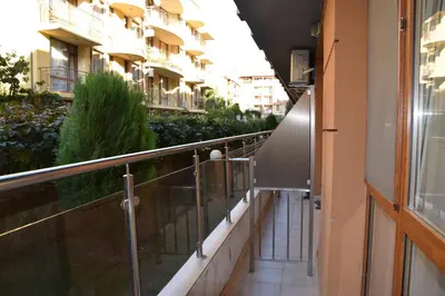 a corridor of a building with a balcony at Studio Sveti Vlas 