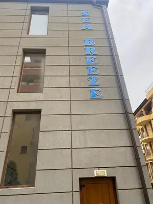 a building with a sign on the side of it at Studio Sveti Vlas 