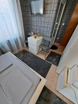 an overhead view of a bathroom with a desk and a chair at The White House in Nesebar