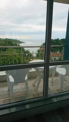 a view from a window of a table and bench at Сити бийч вю in Tsarevo