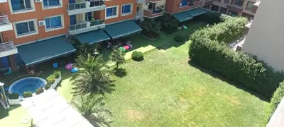 an overhead view of a lawn in a courtyard of a building at Apartment Ground Floor in Pomorie