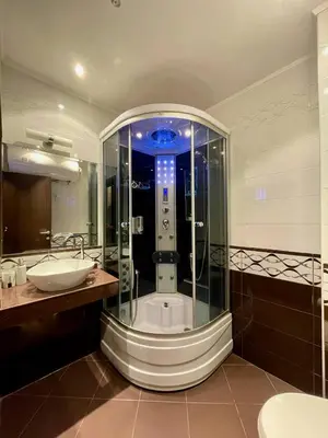 a bathroom with a shower and a sink at Luxurious 2 BR Appt at the Black Sea Coast in Sunny Beach
