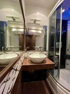 a bathroom with two sinks and a large mirror at Luxurious 2 BR Appt at the Black Sea Coast in Sunny Beach