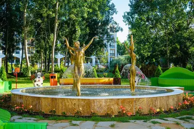 a statue of two women in a fountain at Sunny studio in Sweet Home Complex in Sunny Beach