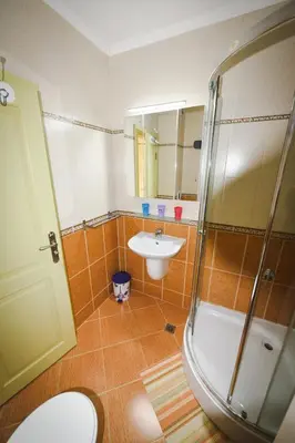 a bathroom with a sink and a shower at Apartments SunWave Saint Vlas in Sveti Vlas