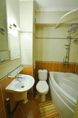 a bathroom with a toilet and a sink and a tub at Apartments SunWave Saint Vlas in Sveti Vlas