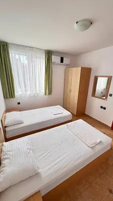 a bedroom with two beds and a window at Fantastic Apartment in Sveti Vlas in Sveti Vlas