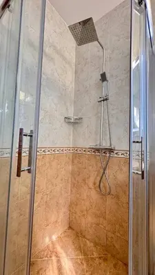 a shower with a glass door in a bathroom at Fantastic Apartment in Sveti Vlas in Sveti Vlas