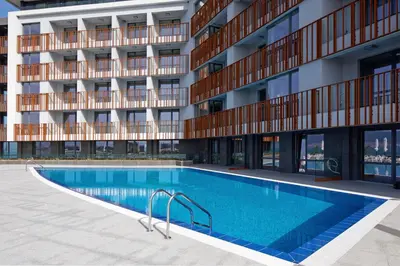 a swimming pool in front of a building at Paradiso Dreams Hotel in Nesebar