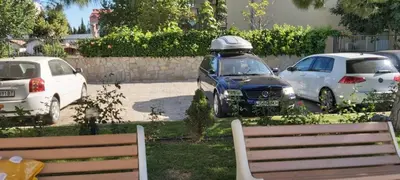 a group of cars parked in a parking lot at Apartmány Rose Residence Nesebar in Sunny Beach