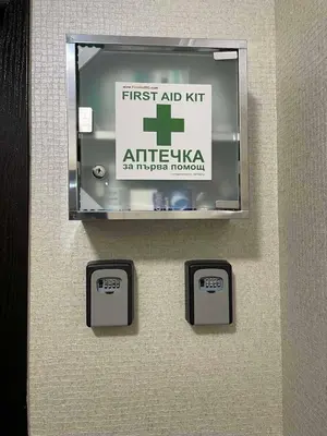 a sign on a wall with a first aid kit at Apart hotel Gallery L in Sunny Beach