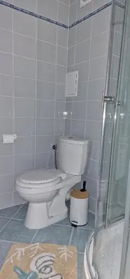 a bathroom with a toilet and a glass shower at Studio Fresh in Sozopol